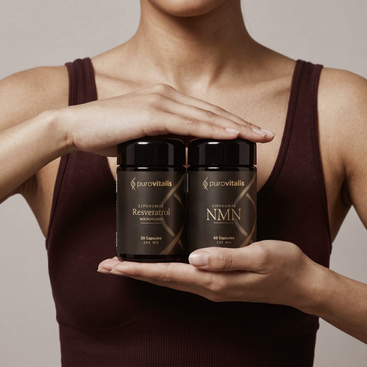 Hands holding PuroVitalis liposomal Resveratrol and NMN